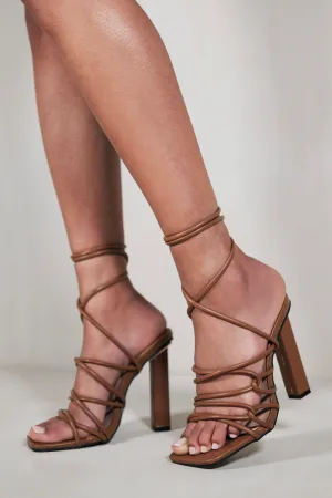 HIGH HEELS WITH A TIE LEG AND CROSS OVER STRAP DETAIL IN CHOCOLATE BROWN FAUX LEATHER